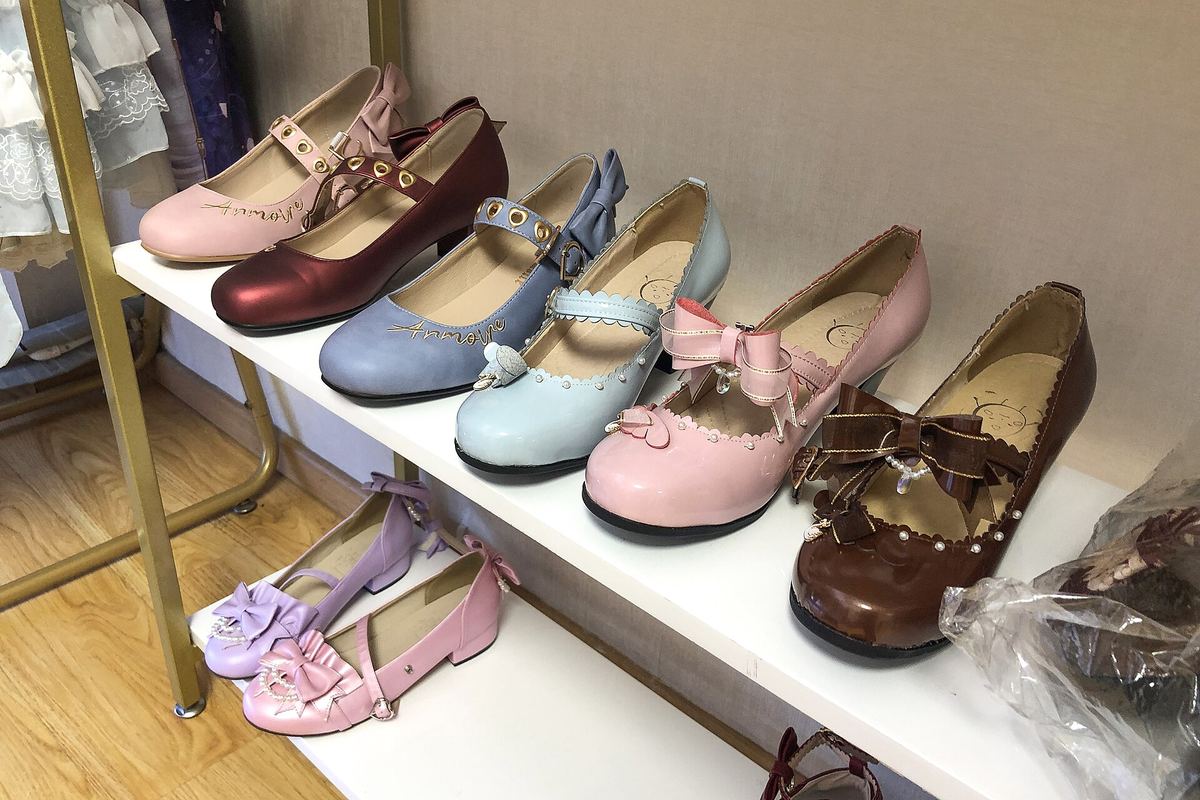 Shelves of shoes in a shop.