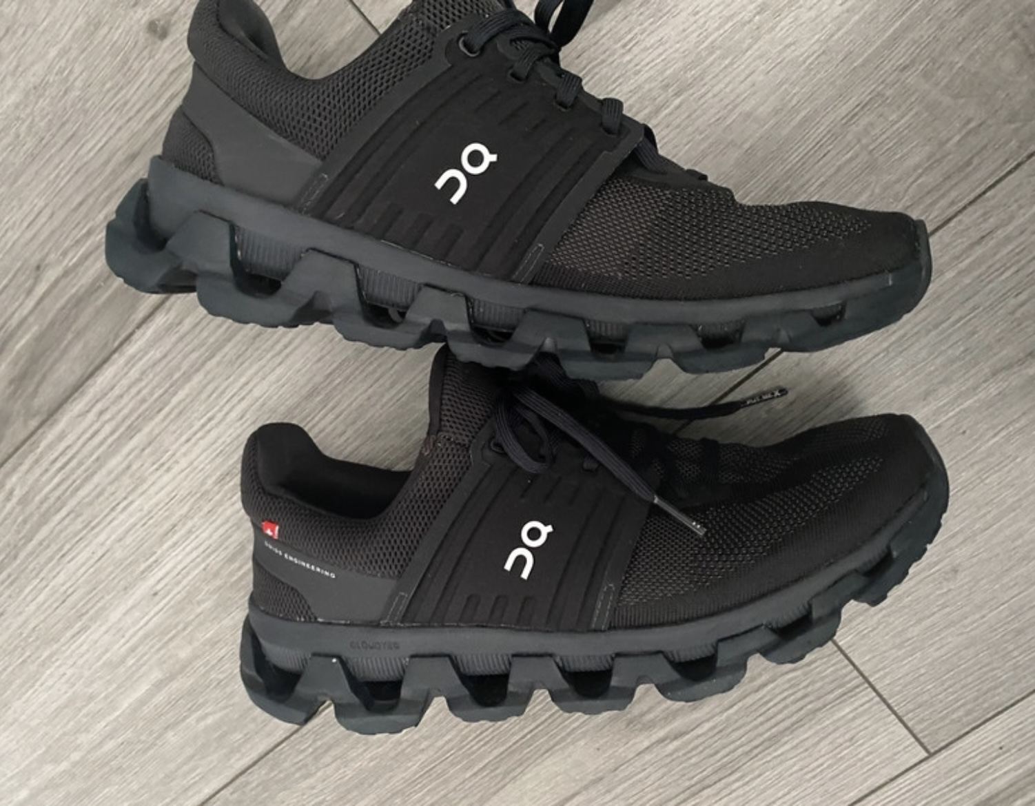 A pair of running shoes photographed together.